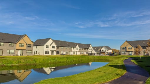 a group of houses next to a body of water