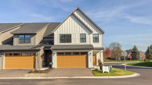 a house with a yellow garage door