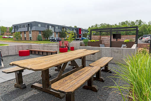a picnic table in front of a building