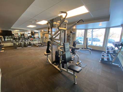 fitness center with weights and cardio machines at Aspenwood Apartments, 1125 Duckwood Trail, Eagan, MN 55123