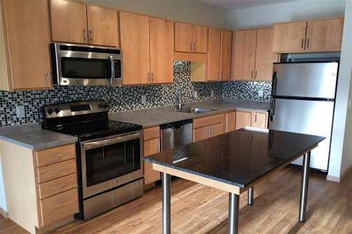 A kitchen with a stove, oven, and refrigerator.at Third North Apartments, Minnesota, 55401
