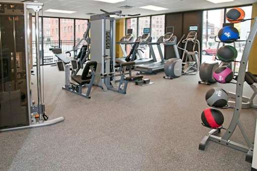 A gym with a variety of equipment including treadmills, weights, and exercise machines.at Third North Apartments, Minneapolis, 55401