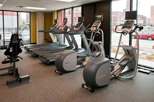 A gym with treadmills and elliptical machines.at Third North Apartments, Minneapolis