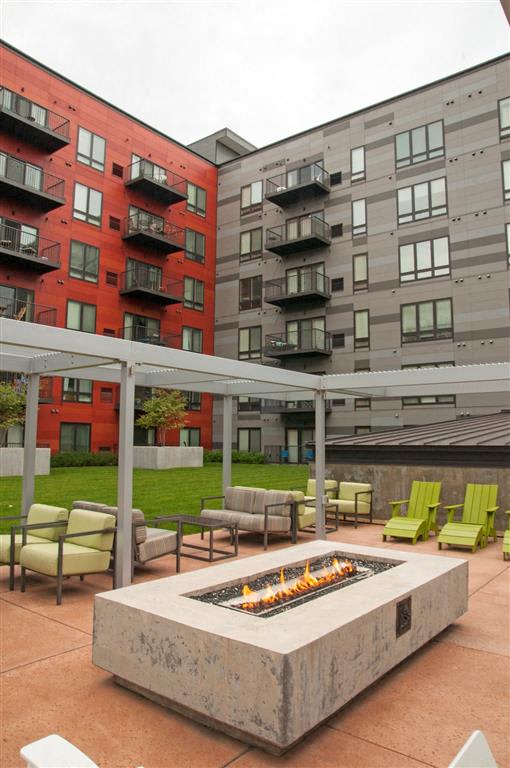 A patio with a fire pit and chairs.at Third North Apartments, Minneapolis, MN 