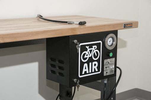 A table with a bicycle air pump attached to it.at Third North Apartments, Minneapolis, 55401