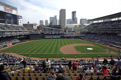 A baseball stadium is filled with fans watching a game.at Third North Apartments, Minneapolis