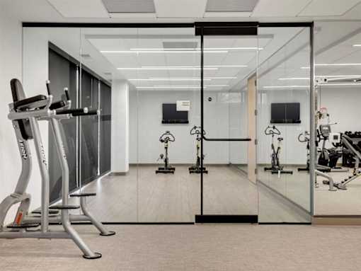 A gym with treadmills and exercise bikes.at Viridium Apartments, Minnesota 