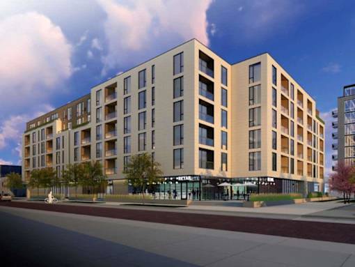 A modern apartment building with a retail store on the ground floor.at Viridium Apartments, Minnesota 