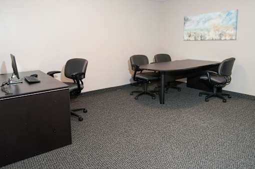 Office Space with Office Chairs, Work Tables and Computers at Compass Pointe in New Hope, MN