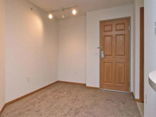 A Room with a Brown Door at Joseph's Pointe at Upper Landing Apartments, St. Paul, MN, 55102