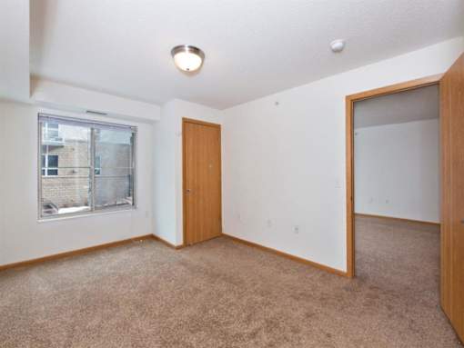 A Room with a Carpeted Floor at Joseph's Pointe at Upper Landing Apartments, Minnesota, 55102