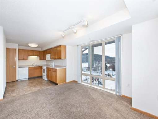 Kitchen with Wooden Cabinets at Joseph's Pointe at Upper Landing Apartments, St. Paul, Minnesota
