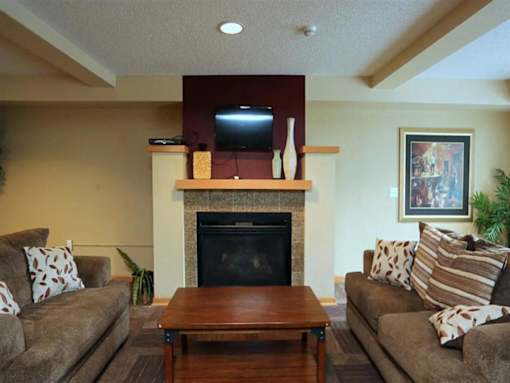 A Living Room with a Fireplace at Joseph's Pointe at Upper Landing Apartments, St. Paul
