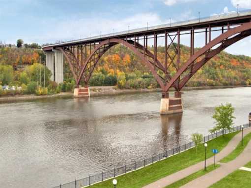 A Bridge Spans Over a River at Joseph's Pointe at Upper Landing Apartments, Minnesota, 55102