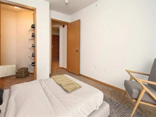Bedroom with a Bed at Joseph's Pointe at Upper Landing Apartments, St. Paul