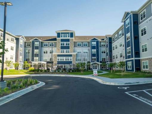 A large apartment complex with a road in frontat The Barnum Apartments, White Bear Lake, 55110