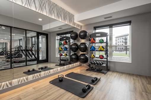 A well-equipped home gym with a variety of exercise equipment.