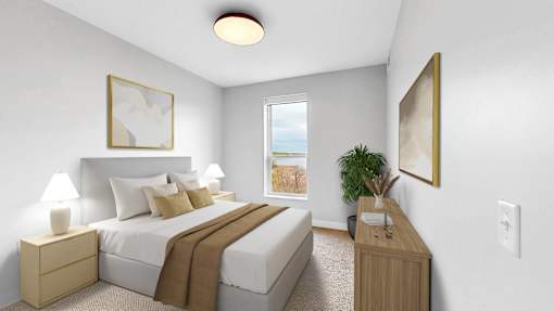 A bedroom with a large bed and a window overlooking a beach.