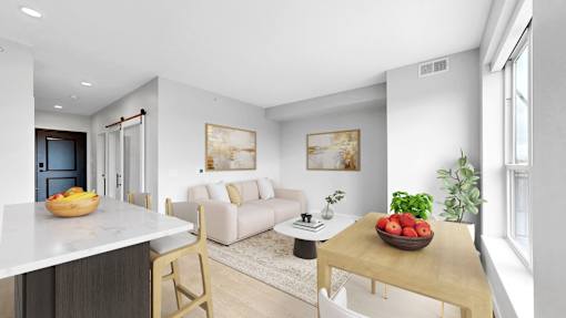 A modern kitchen with a dining table and chairs.
