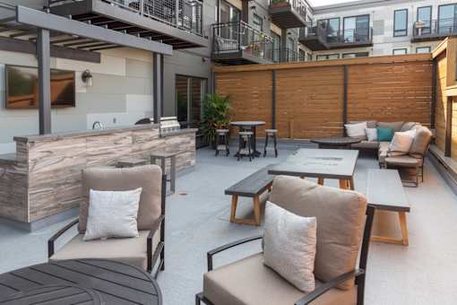 A patio with a table and chairs.
