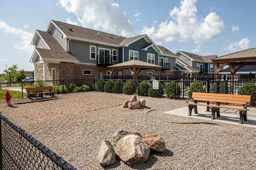A park area with a bench and a fire hydrant at The Edison at Spirit, Lakeville Minnesota