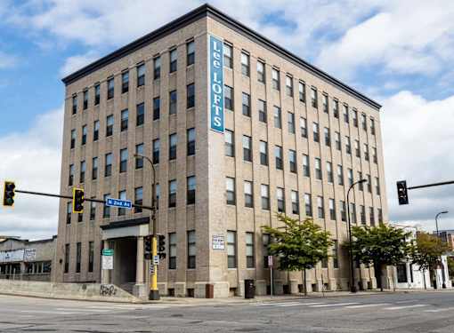 A Lee Lofts building is shown with a blue sign on the side.