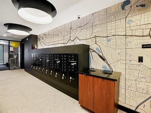 A black and white map is on the wall behind a black counter.