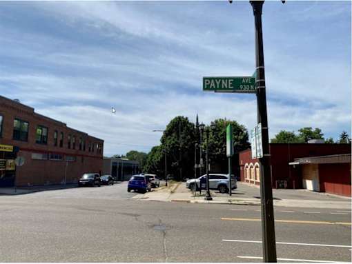 A street view of Payne Avenue with cars parked on the side of the road.