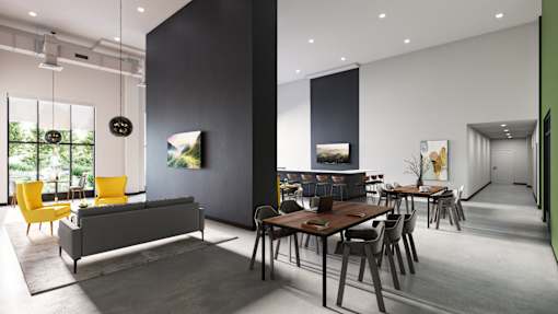 A modern living room with a grey sofa, yellow chairs, and a wooden dining table at Soul Apartments, St. Paul, MN