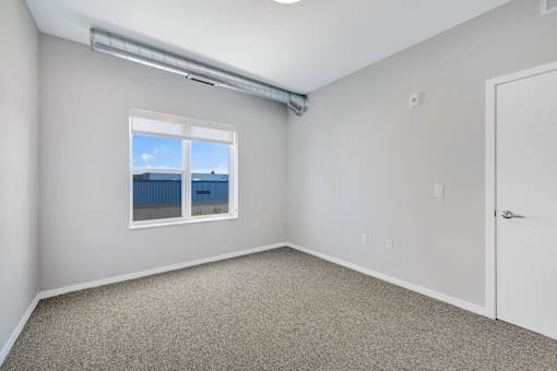 A room with a window overlooking the ocean at Soul Apartments, St. Paul, MN 55107