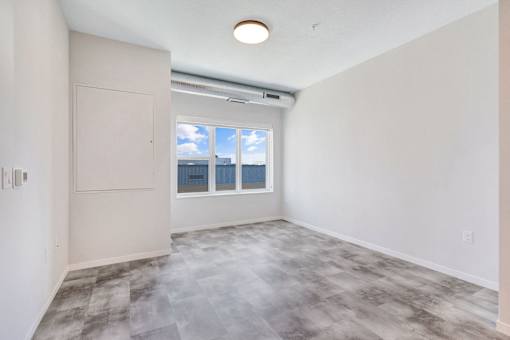 A room with a sliding glass door leading to a balcony at Soul Apartments, Minnesota 55107