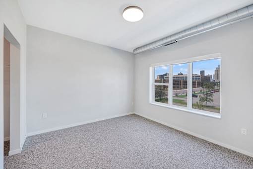 A room with a window and a view of the city at Soul Apartments, Minnesota 55107