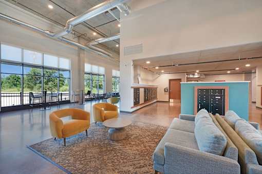 A room with a couch, chairs and a table at Soul Apartments, Minnesota