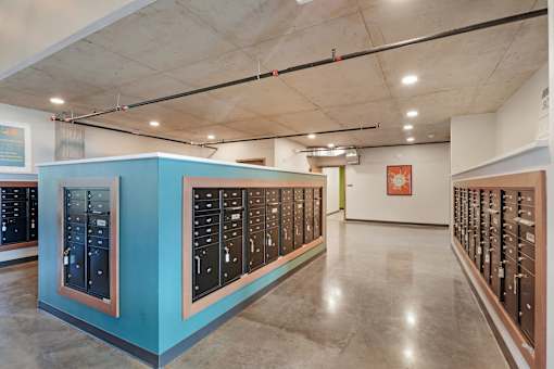 A room with a long row of lockers on the wall at Soul Apartments, St. Paul, Minnesota