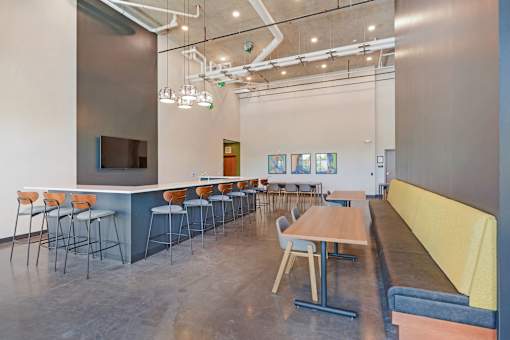A modern room with a long table and chairs at Soul Apartments, Minnesota 55107