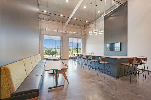A modern room with a long table and chairs at Soul Apartments, Minnesota