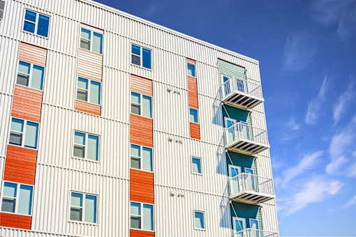 A tall building with balconies and windows at Soul Apartments, St. Paul