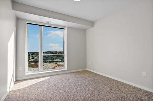 A room with a large window at Croft at Rosecott, Rosemount, MN