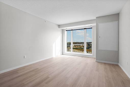 A room with a sliding glass door leading to a balcony.at Croft at Rosecott, Rosemount 