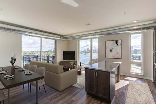 Living Room with a Dining Table at Peregrine Apartments, Minneapolis