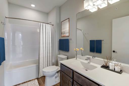 Bathroom with a White Toilet at Peregrine Apartments, Minneapolis, MN