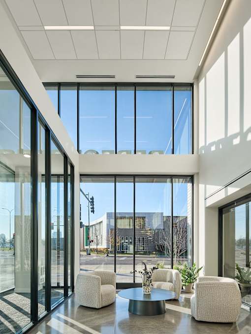 A Modern Interior with a Glass Wall at Peregrine Apartments, Minnesota
