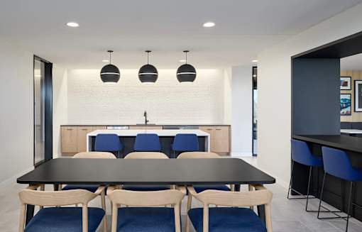 Dining Area with a Large Table at Peregrine Apartments, Minneapolis