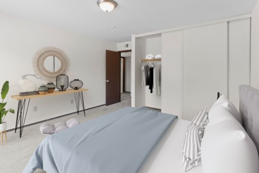 a bedroom with a bed and a wardrobe in a 555 waverly unit