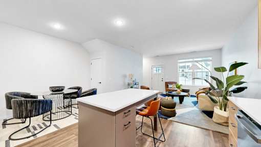 A modern kitchen with a white countertop and a large island.