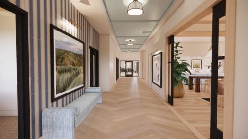 a long hallway with pictures on the walls and a wood floor at Sandhill Parkway Townhomes Apartments, East Bethel