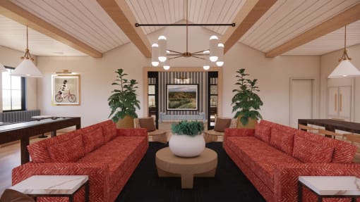 a living room with red couches and a table and chairs at Sandhill Parkway Townhomes Apartments, East Bethel