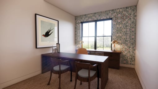 a study area with a desk and chairs and a window at Sandhill Parkway Townhomes Apartments, East Bethel