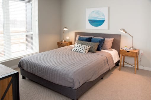 Master Bedroom With Carpeting at The McMillan Apartments in Shoreview, MN 55126