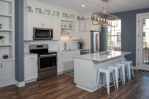 Kitchen With White Cabinetry And Appliances at The McMillan, Minnesota, 55126